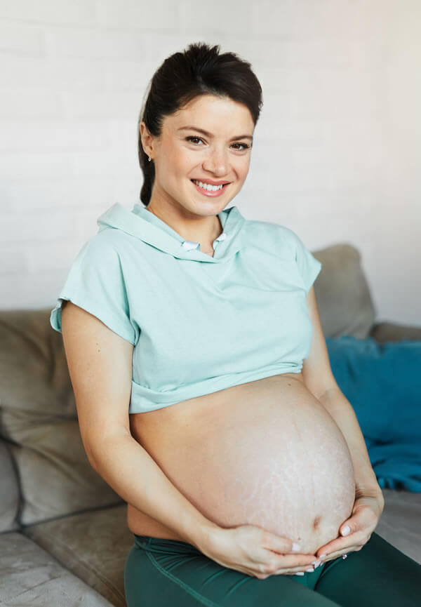 Expectant parents discussing birth preferences and childbirth preparation