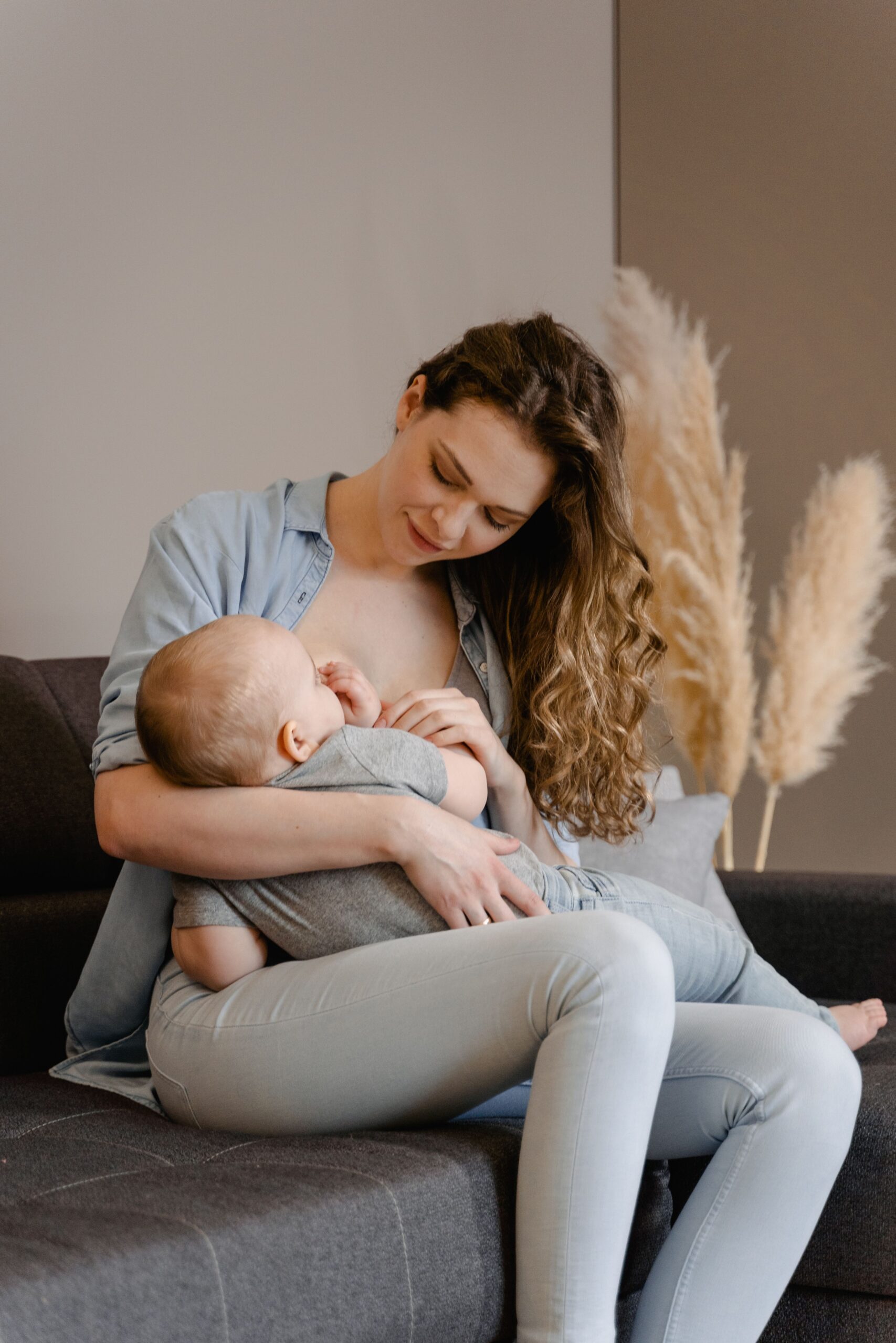 Mother receiving breastfeeding and postpartum support from Cradle and Co Birth
